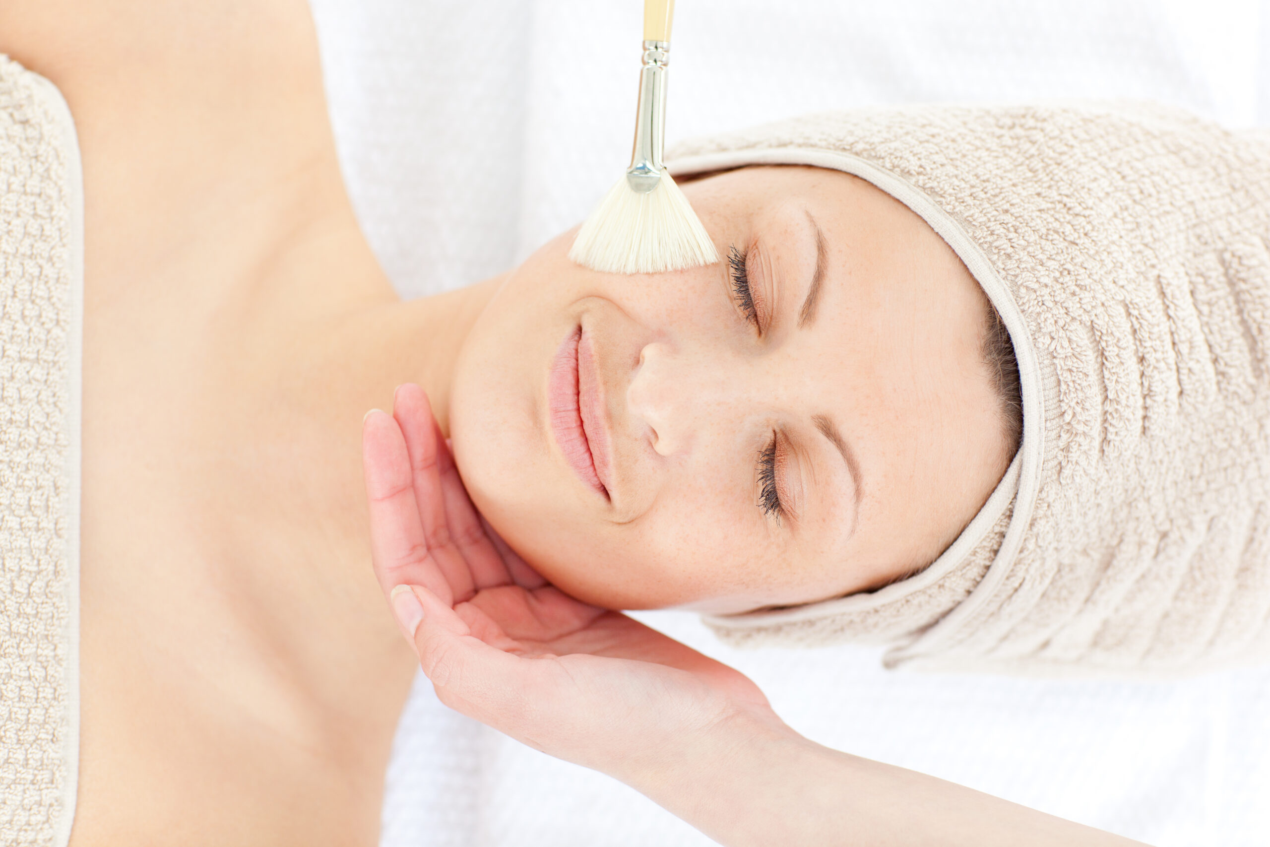 Relaxed female having a mini facial treatment